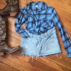 Distressed denim mini skirt